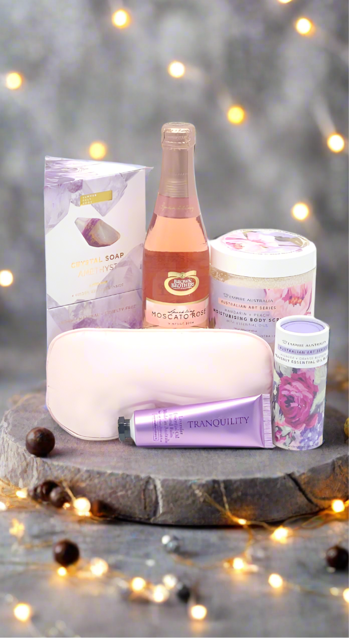 Collection of beauty products on a natural stone with a blurred light background
