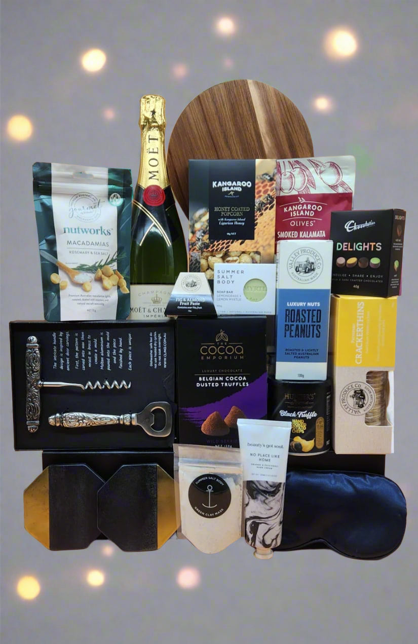Gourmet gift basket with champagne, chocolate, and other items 
